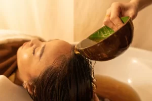 Woman Enjoying her herbal hair treatment session